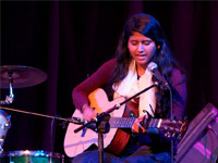 Student who plays guitar during her lesson