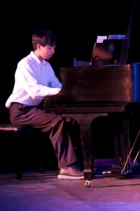 Student who take Piano Lessons Playing Piano